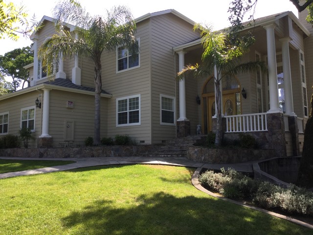 Colonnaded estate exterior after repaint