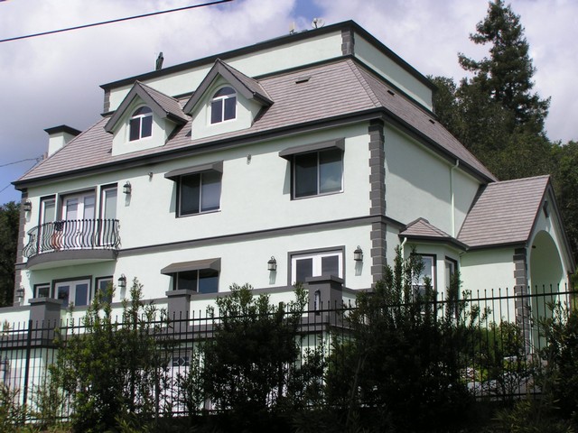 Stucco waterproofing and repaint with an elastomeric system