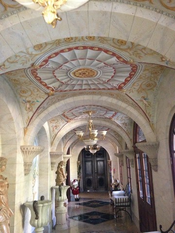 Custom decorative finish on a vaulted stone hallway ceiling